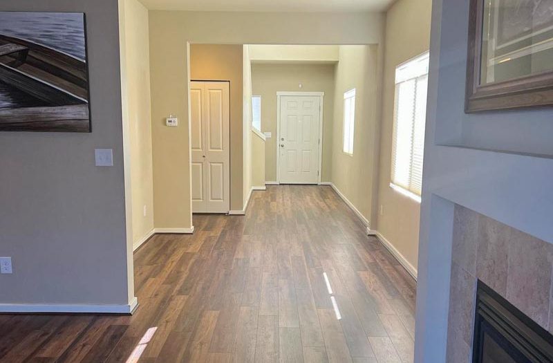 Dark hardwood plank flooring in an open foyer with high ceilings, installed by Simple Floor Solutions in Maple Valley, WA