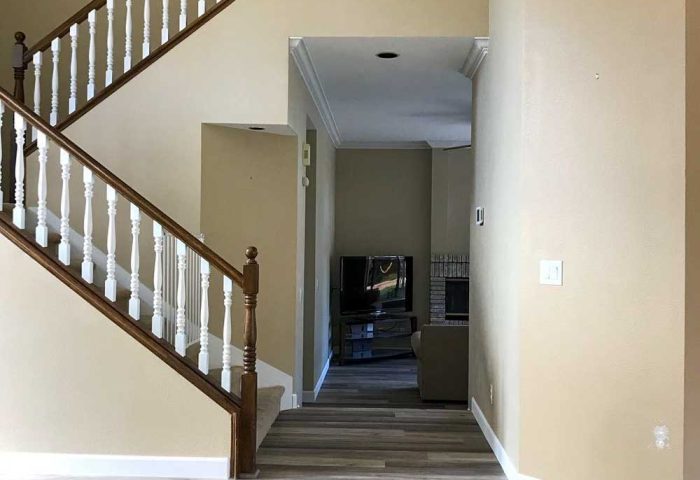 Light luxury vinyl plank flooring in a two-story foyer installed by Simple Floor Solutions, Enumclaw, WA flooring company